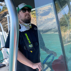 Erik Urdahl driving a boat near Port Orford, Oregon